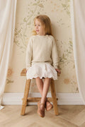 Pull en tricot de coton vanille texturé avec manches bouffantes et boutons aux épaules pour bébé et fille
