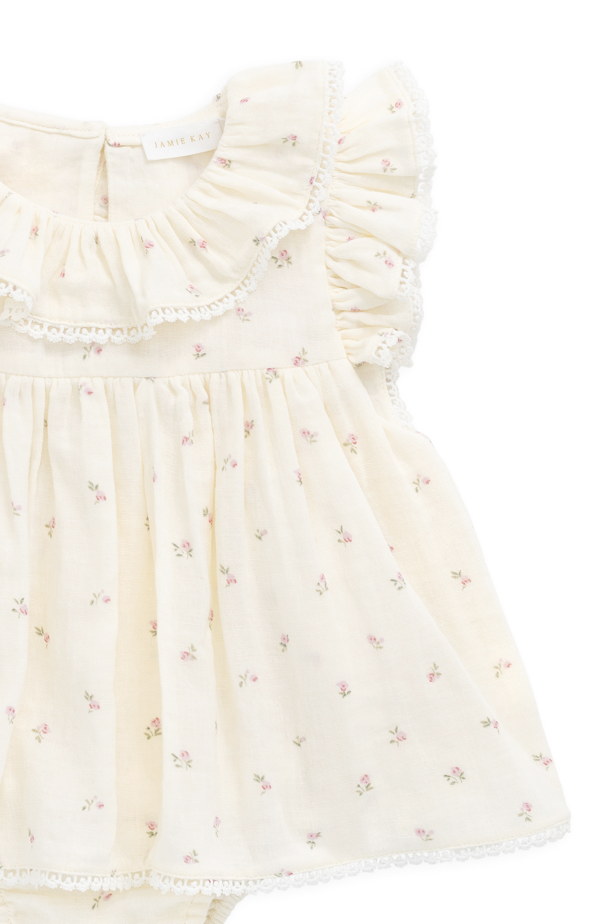 Barboteuse en mousseline de coton biologique motif fleur rose et saule pour bébé fille avec col à volants